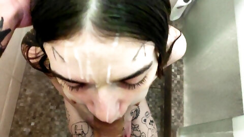 Wet cutie sucks cock in the shower before massive facial